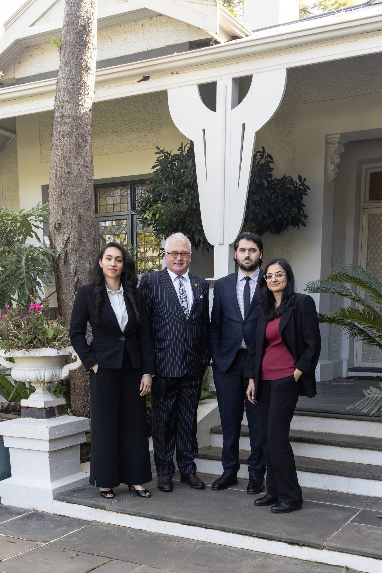 The Steven M Clark Lawyers team on the front steps of the firm's Gawler South office